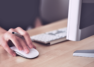 Worker on a Laptop Using Mouse